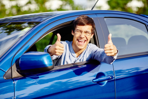 Person Giving Thumbs Up in Blue Car Maryland